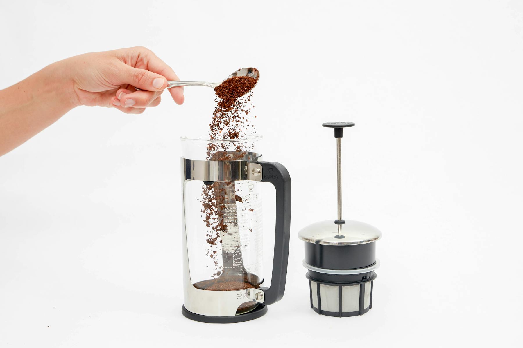 Place ground coffee in French Press