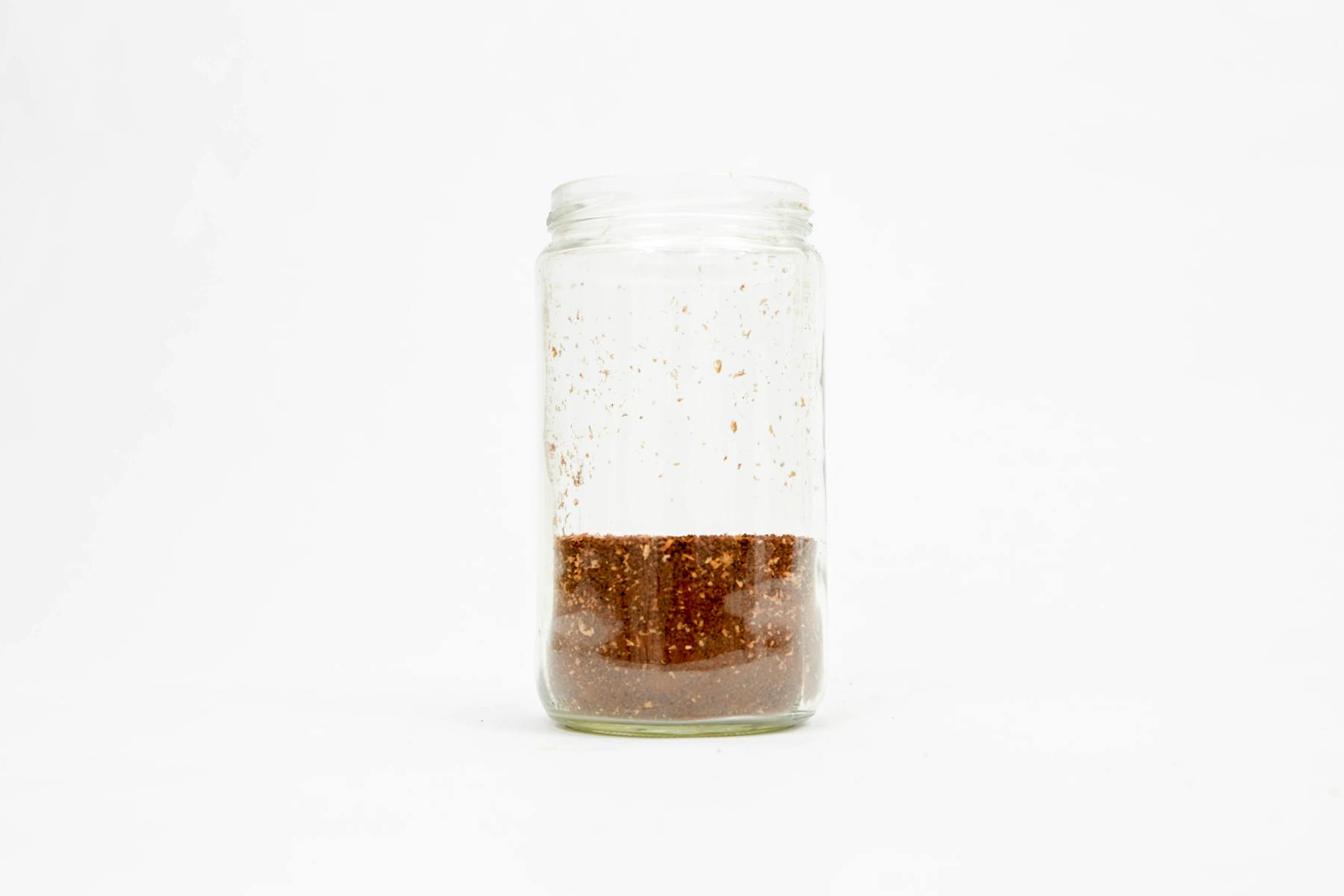 Place ground coffee in mason jar
