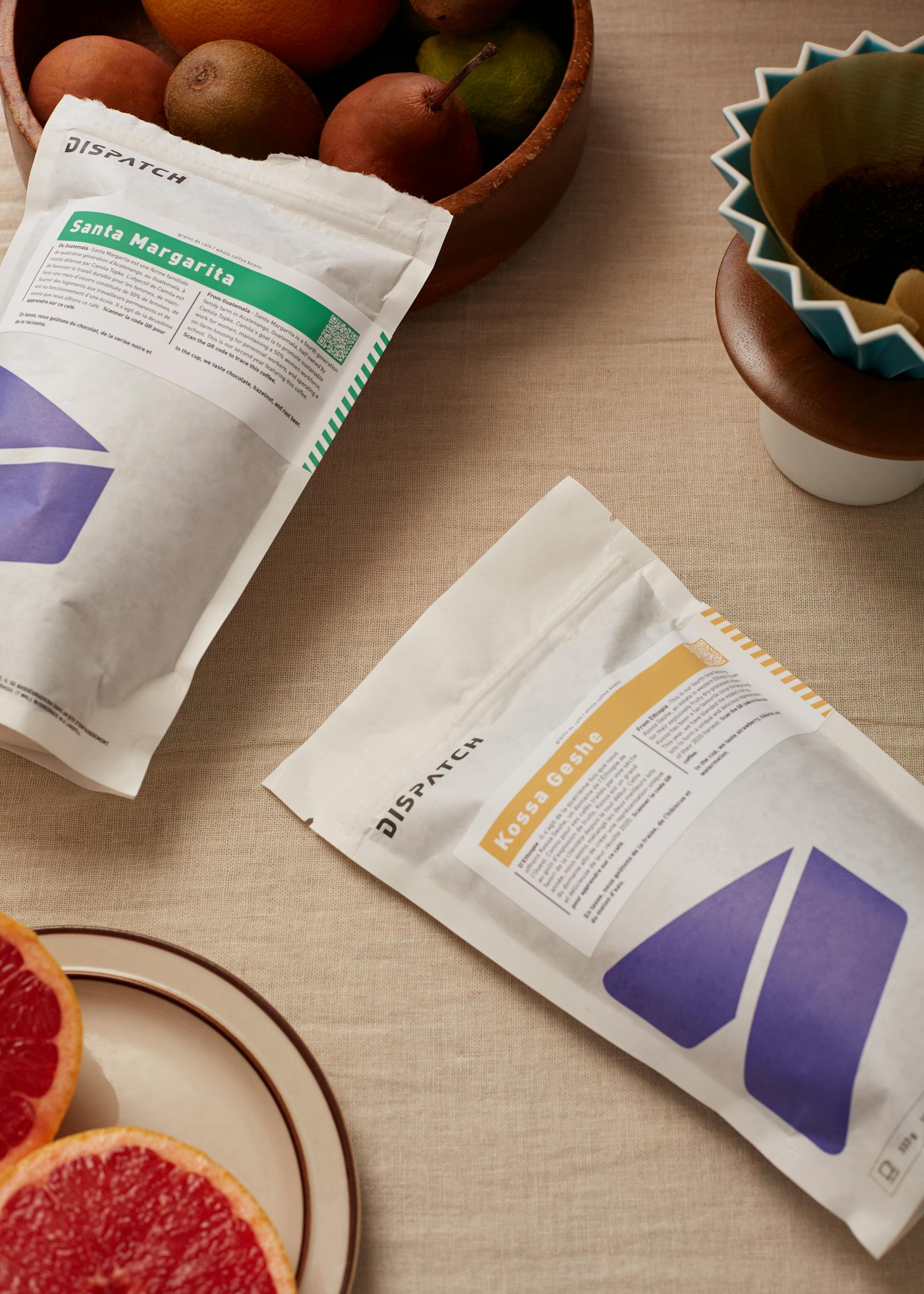 Sam fournier, 2 coffee bags on table w/ grapefruit
